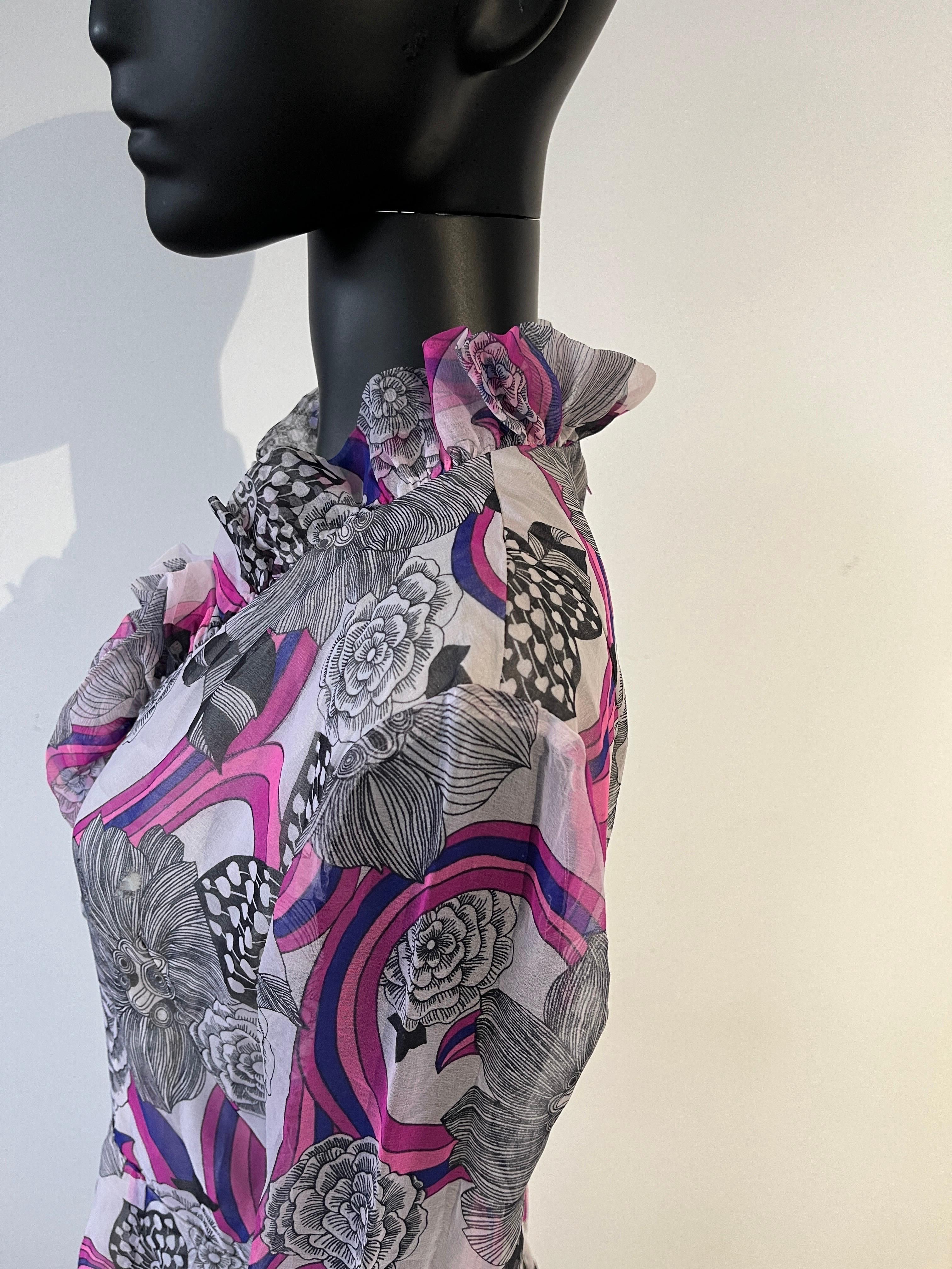 This really is a spectacular piece of 1970’s evening wear, a brightly botanical patterned long dress with bodice with ruffled frill front detail. 

The retro abstract psychedelic print is fantastic in multi colour hues. Black and white floral with