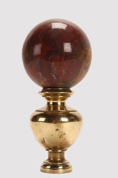 A sphere of red jasper, mounted on a brass base, Italy 1890.