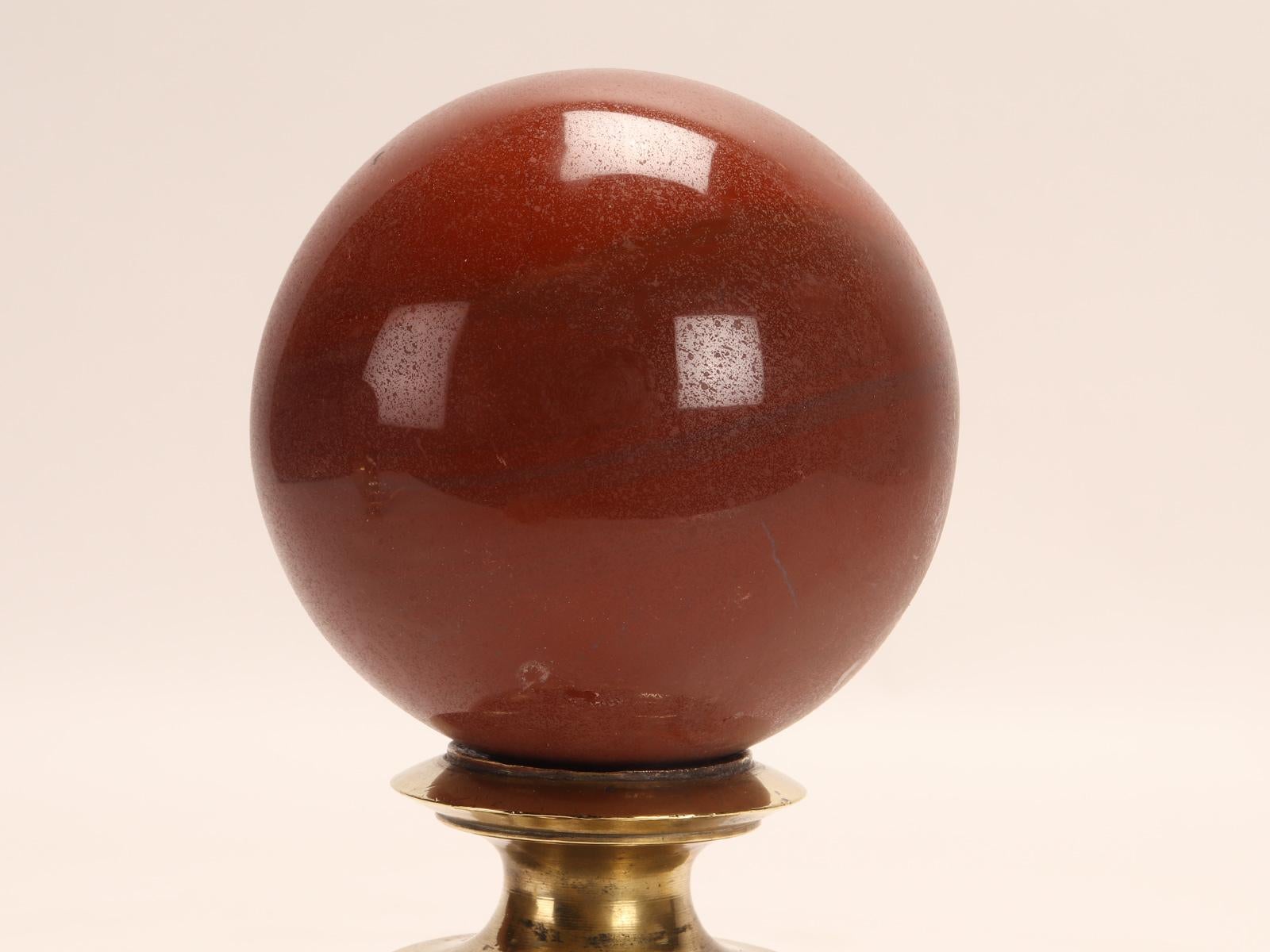 Italian A sphere of red jasper, mounted on a brass base, Italy 1890. For Sale