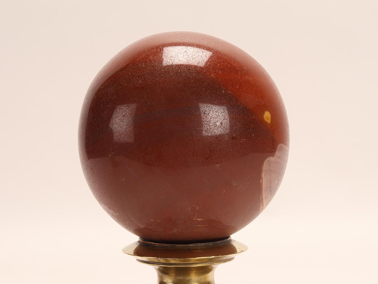 A sphere of red jasper, mounted on a brass base, Italy 1890. In Good Condition For Sale In Milan, IT