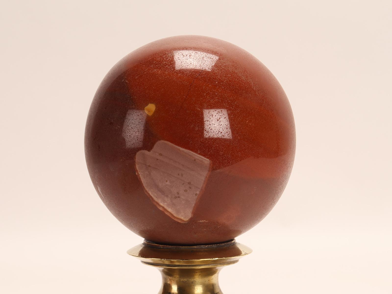 19th Century A sphere of red jasper, mounted on a brass base, Italy 1890. For Sale