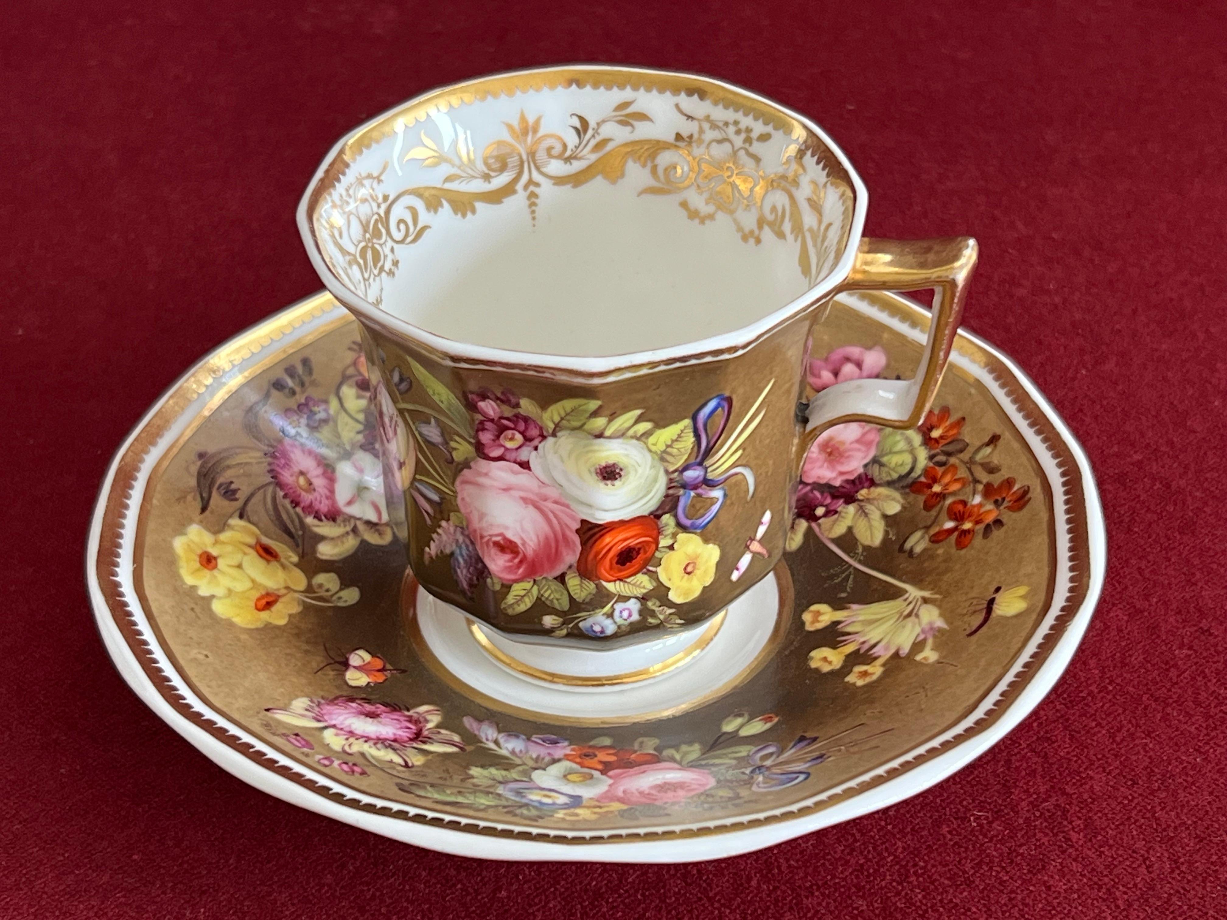 A fine Spode porcelain coffee cup and saucer c.1830. Although the cup has twelve sides, it is still called 'Octagon' shape, which was introduced by Spode 1829.

Very finely decorated with floral bouquets with blue-purple-white ribbon bows, and