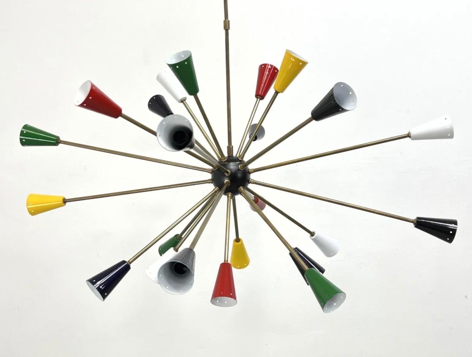 A brass and metal Mid Century sputnik starburst chandelier by Stilnovo. The many arms having colorful metal cones on each arm. Measures: 44 inches in Diameter, 44 inch drop.