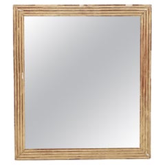 A square French Empire gilt wood mirror circa 1860. Antique A square French Empire gilt wood mirror circa 1860.