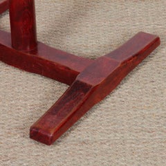 A square-topped dining table made of solid wood, dating from the 1980s