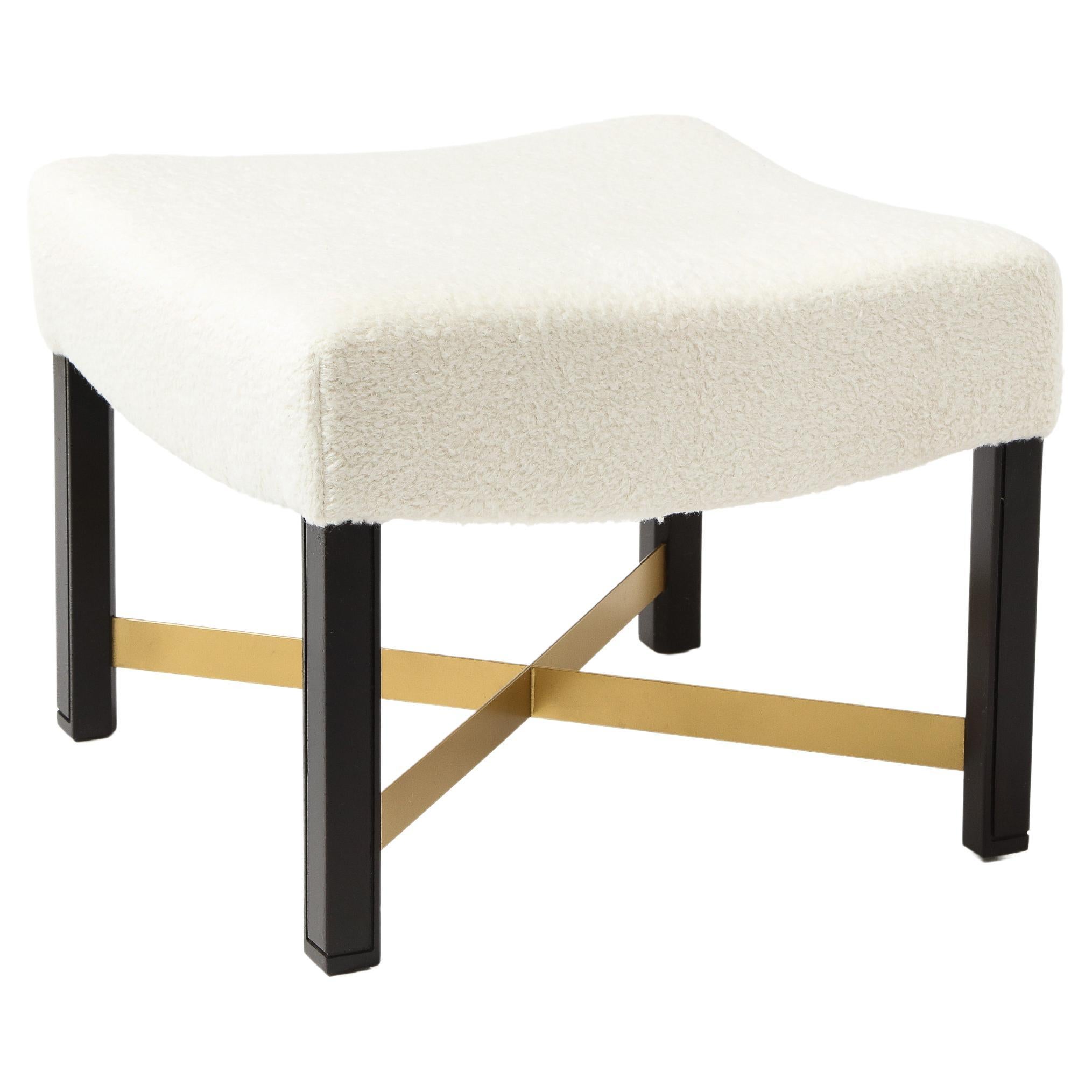 A square walnut and brass ottoman by Marden of Chicago upholstered in wool.