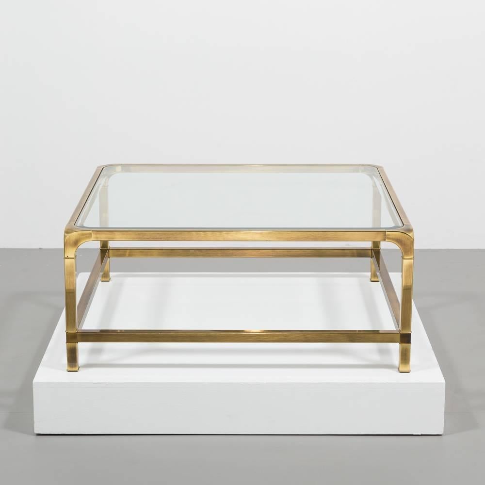 A square Widdicomb designed brass framed coffee table with inset glass top, 1970s

Widdicomb was purchased by John Widdicombe in 1970 and is known for working with designers T.H. Robsjohn-Gibbing and George Nakashima on their modern designs.

