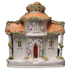 A Staffordshire pottery model of an English cottage circa 1860 English