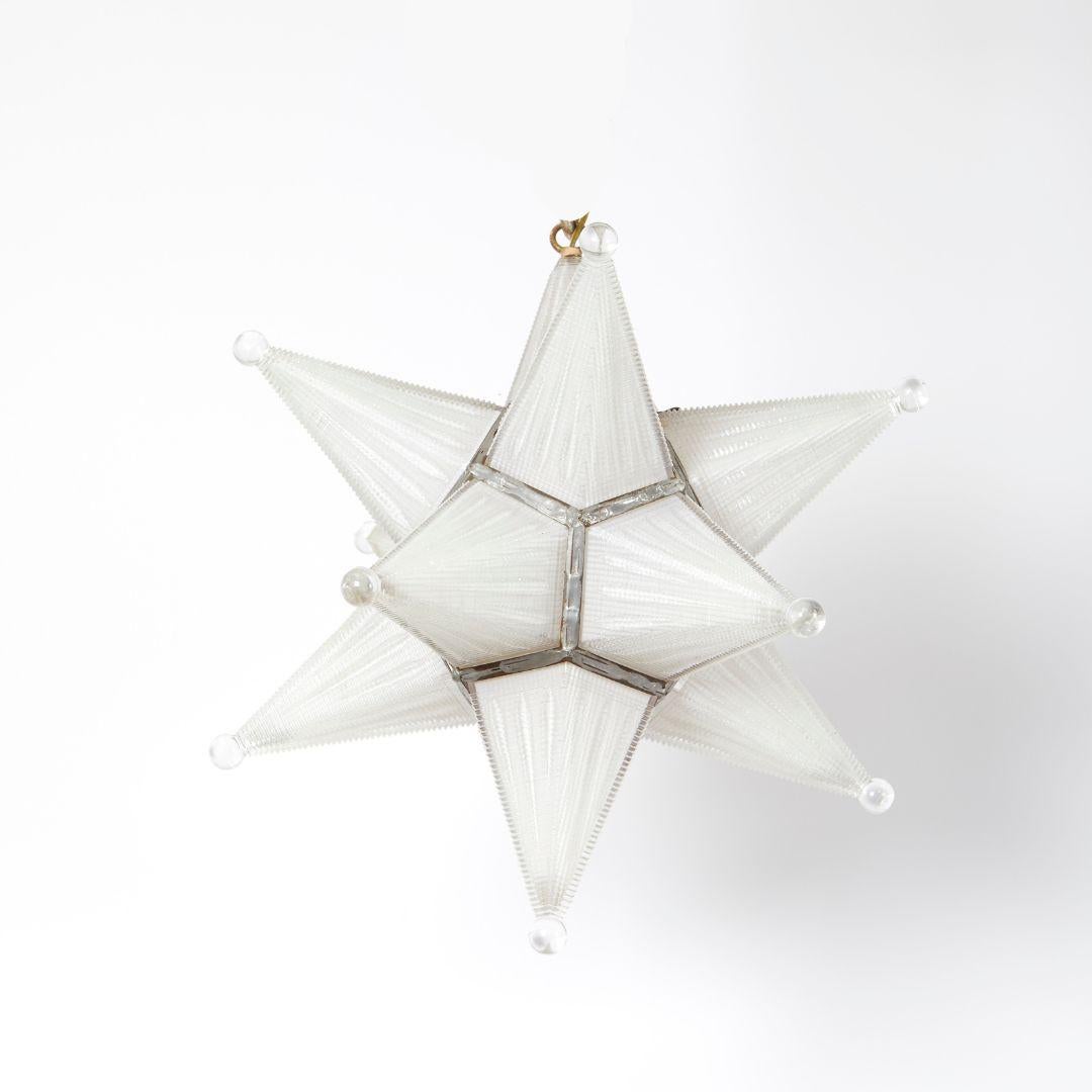 An American star shaped Holocene glass fixture with a metal frame. Each conical section with a glass ball end. Circa 1930