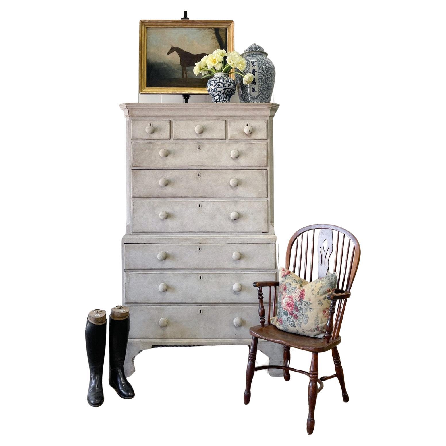 A large, beautiful and fine English country 18th century painted mahogany highboy. Displaying a stately row of knobs and graceful bracket feet that are a bit taller than average, giving a finer overall look. Chamfered and reeded corners and