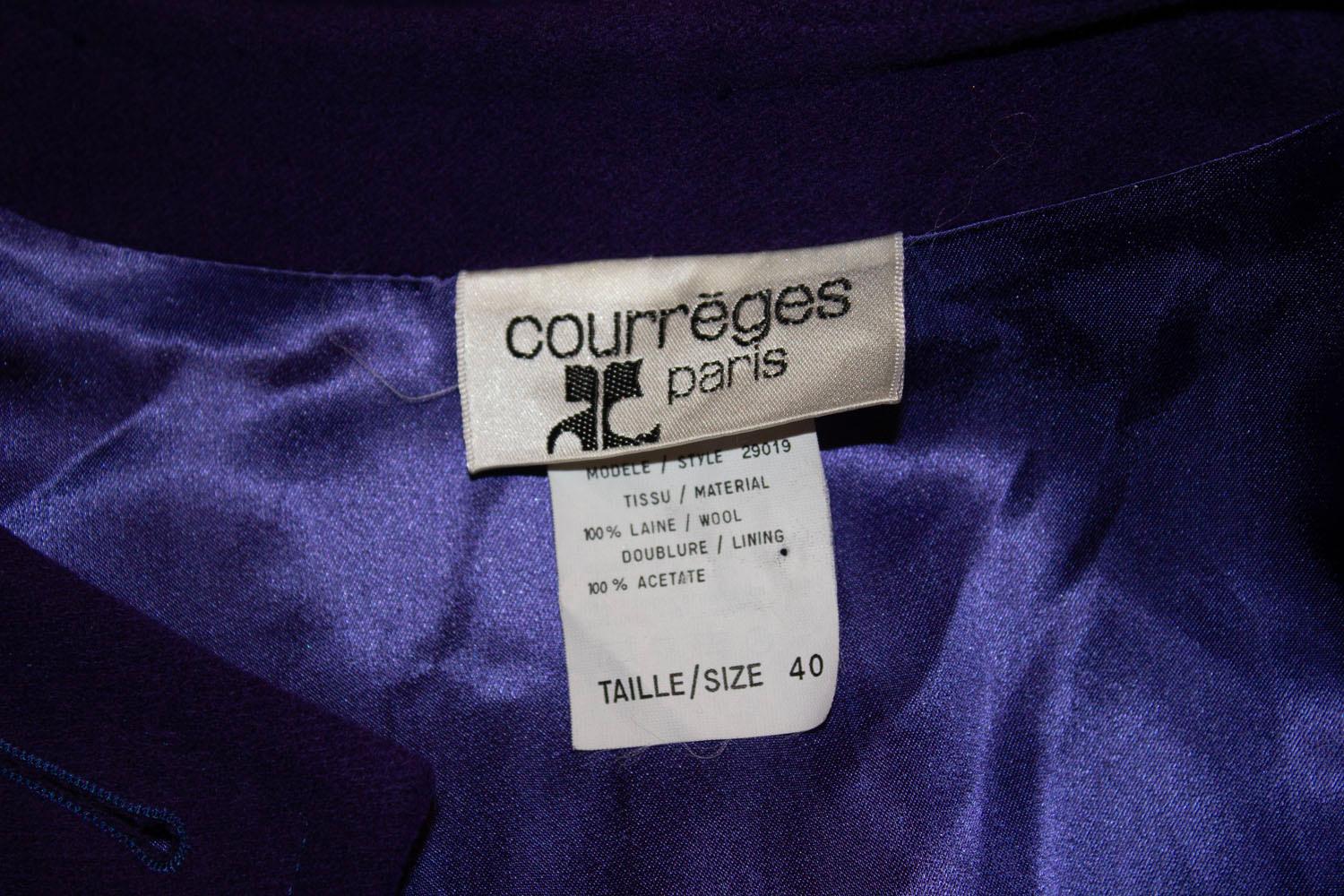 A wonderful and warm vintage coat by Courreges. The coat is in a vibrant purple colour, and  is  collarless with a button front opening. It is fully lined, and has two top pockets and two lower patch pockets. Size 40. Measurements Bust up to 44
