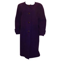 A statement vintage purple coat by Courreges