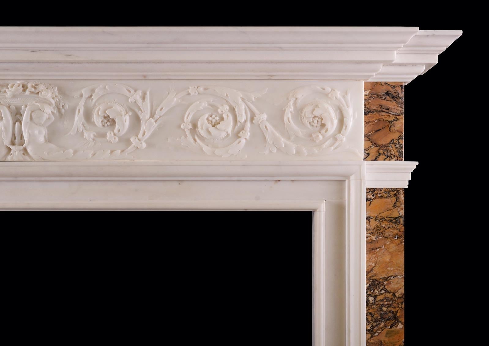 A fine quality Statuary white marble fireplace with Italian Sienna marble inlay. The delicately carved frieze featuring scrolled leaves and bellflowers, with central female figures surmounted by cascading flowers and foliage. The jambs inlaid with