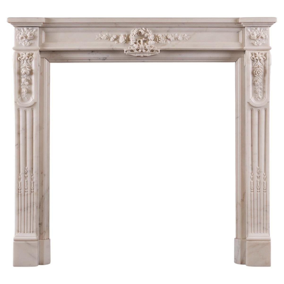 A Statuary White Marble Fireplace in the Louis XVI Style