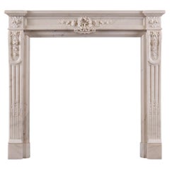 Antique A Statuary White Marble Fireplace in the Louis XVI Style