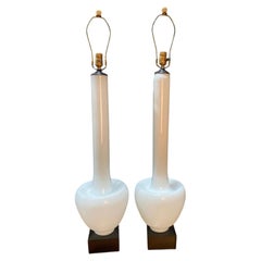 A Statuesque pair of Cased Glass Murano table lamps on Black Walnut bases