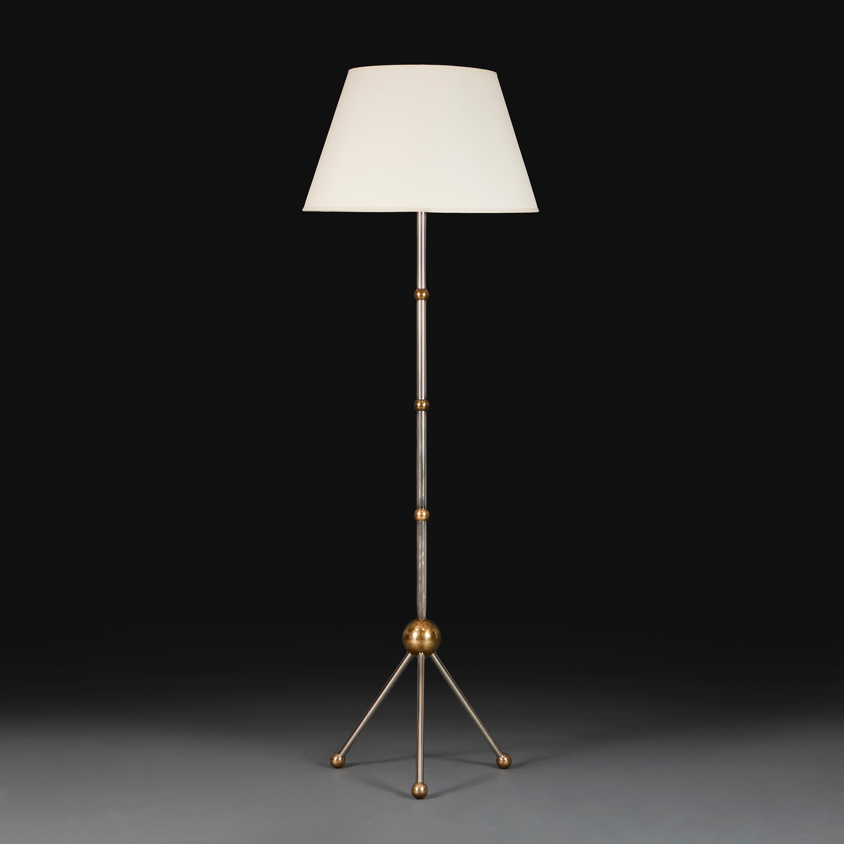 England, made to order.

A tripod floor lamp of sputnik design, in contrasting polished steel and brass. 

Lead time 5 – 7 weeks. 

Height 151.00cm

Width of base 47.00cm

Photographed with a 24” diameter Pembroke card lampshade.

Please note: This