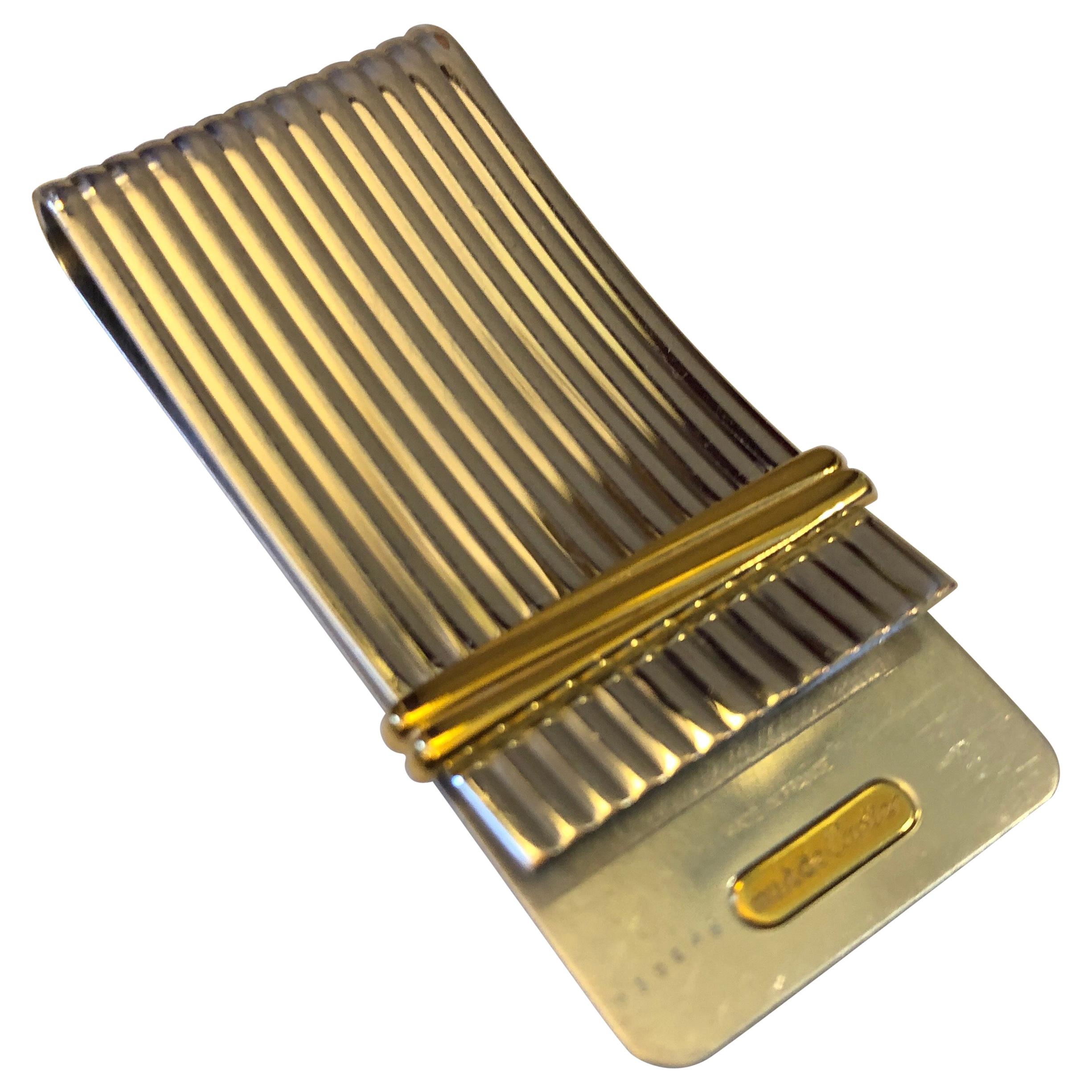 A Steel and Gold Vintage Cartier Money Clips circa 1980