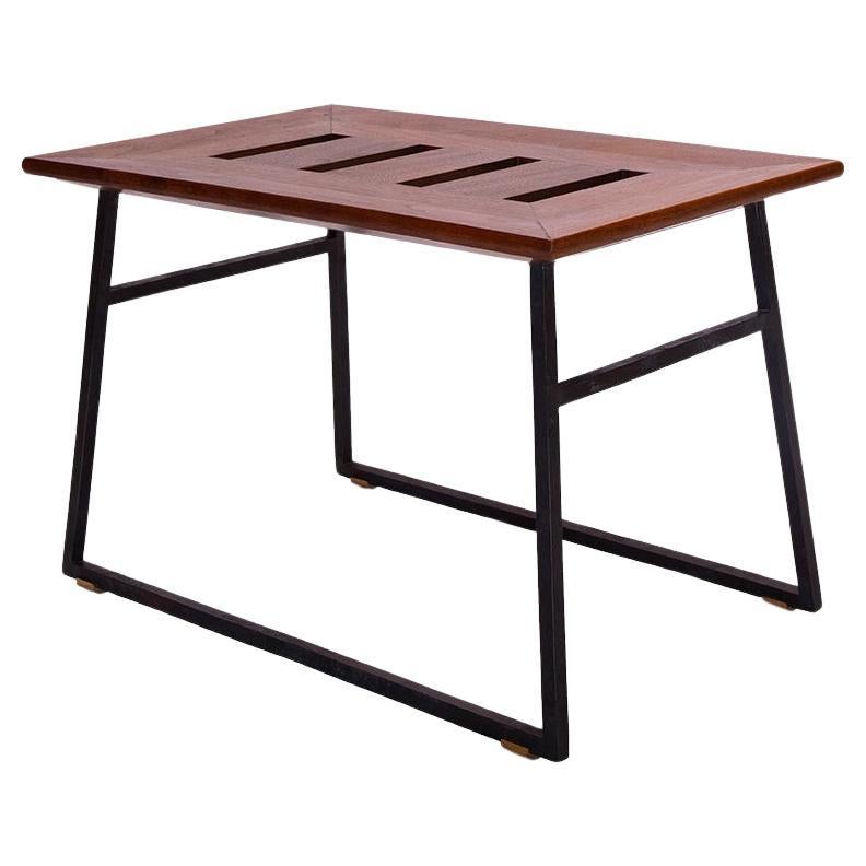 A steel and walnut occasional stool designed by Chester Jones