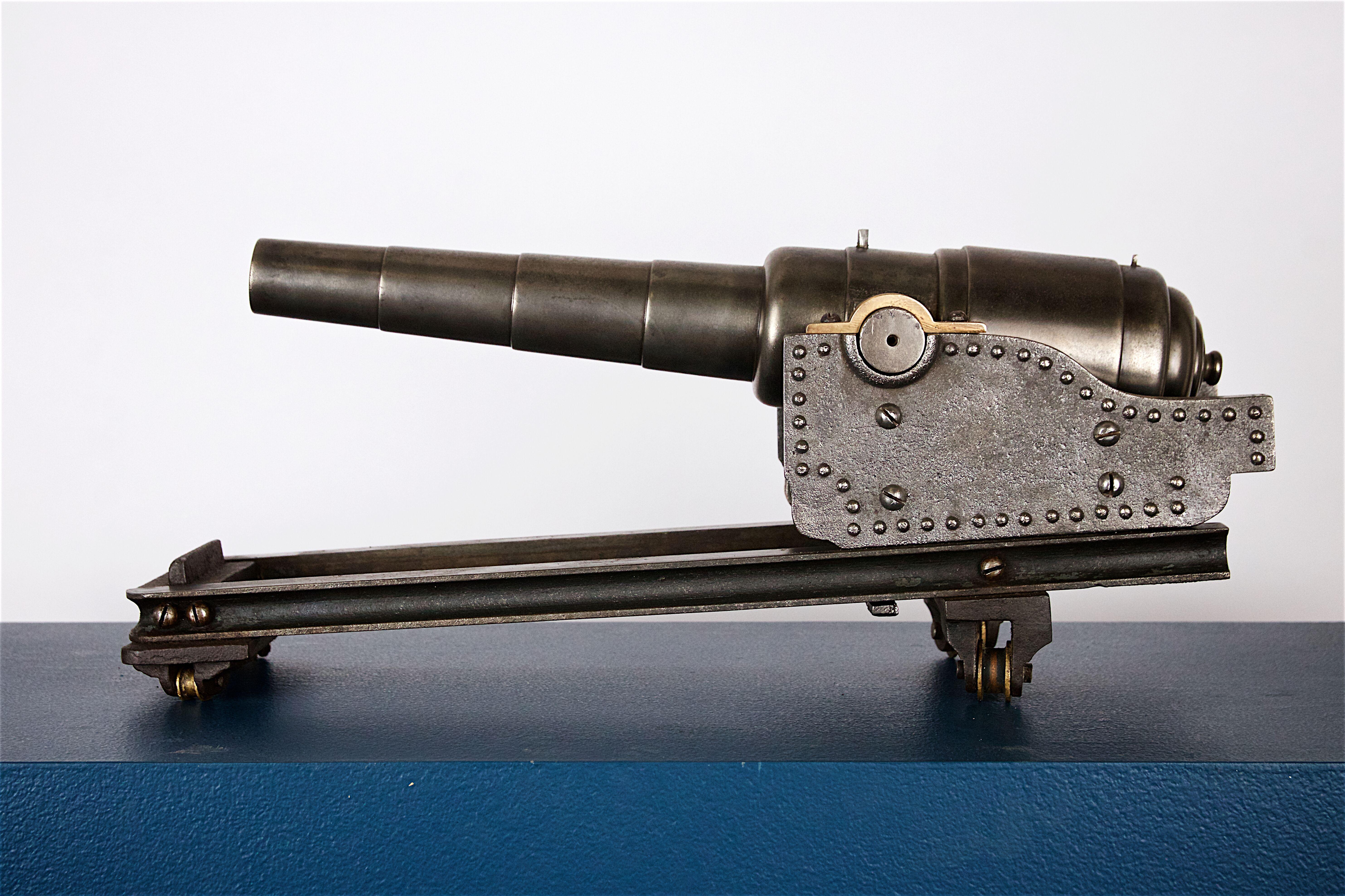 A very good quality steel model of a 64 pound canon on elevating carriage, circa 1860 - English.