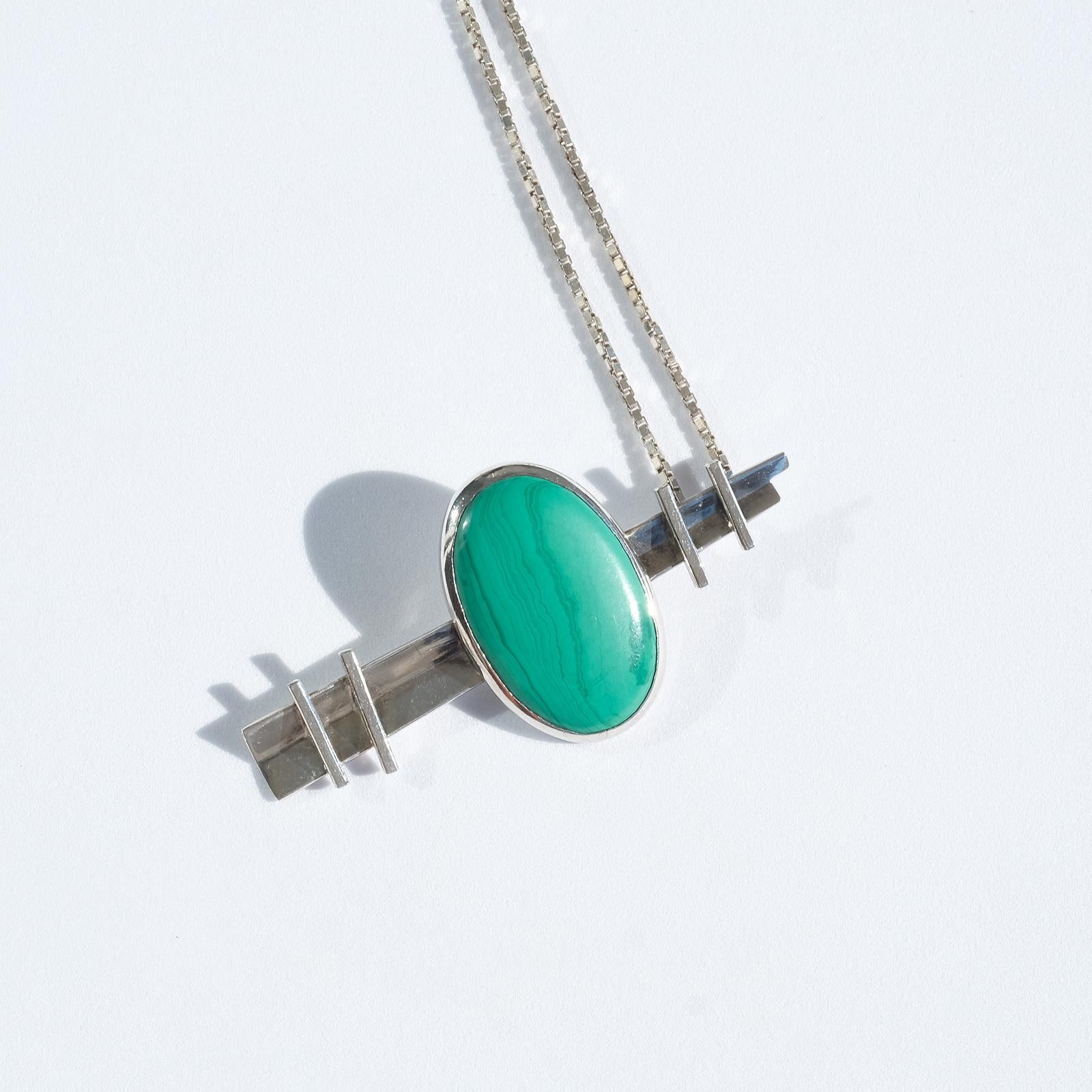 This sterling silver necklace has a venetian chain and a silver and malachite pendant. The malachite stone has a cabochon cut and it literally glows with its beautiful green color.

The necklace is perfect for the everyday wardrobe. 

Did you know