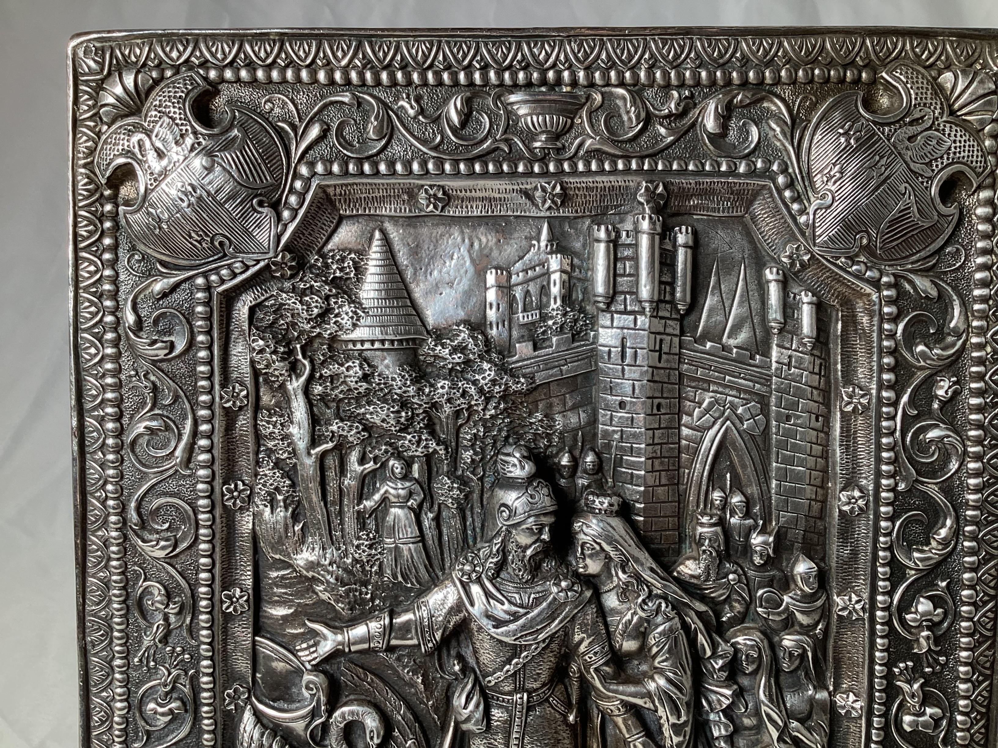 A finely detailed sterling silver repousse plaque with knight, castle, coat of arms swan by Henryk Winograd. Measures: 10.25 high, 7.75 wide.

Henryk Winograd was one of the world's greatest 20th Century masters of traditional silversmithing