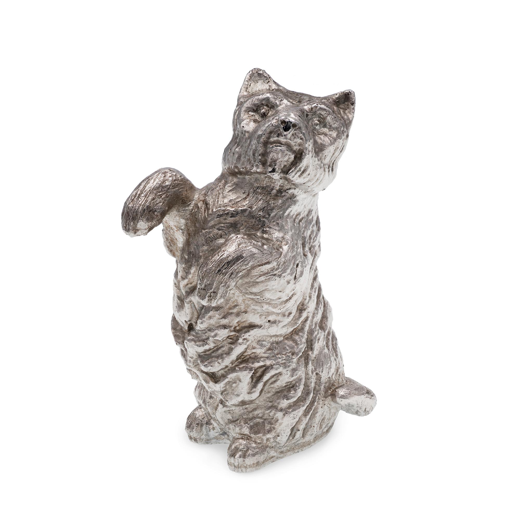 A cast sterling silver dog model, height 7.5cms, weight 156gms, hallmarked London, bearing the Bentley & Skinner sponsor mark. 

Should you choose to make this purchase we will delighted to send it to you beautifully gift-wrapped in a Bentley &