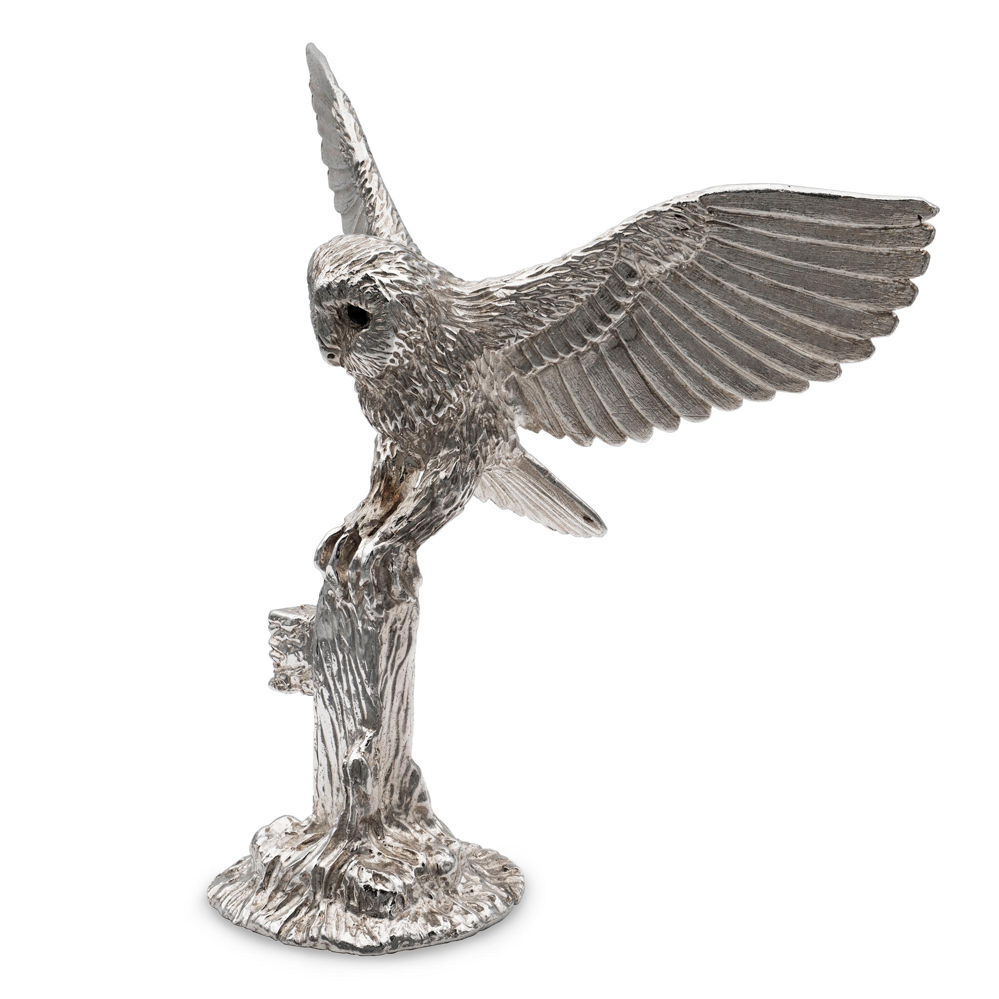 A sterling silver cast model of an out stretched winged owl on a post, the owl is set with black diamond eyes, height 8cms, weight 139gms, hallmarked London. 

Should you choose to make this purchase we would be delighted to send it to you in a