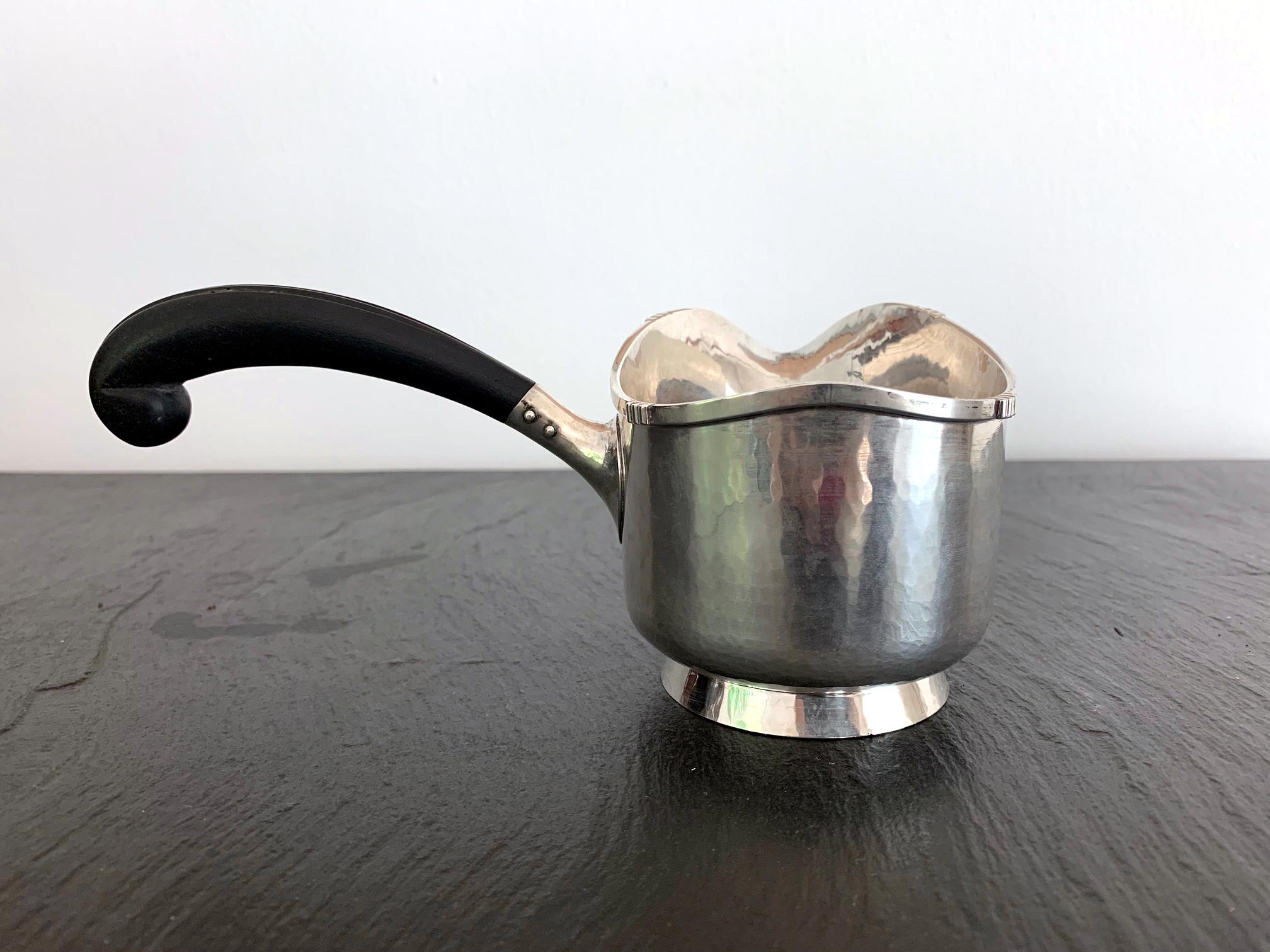 A sterling silver server piece for gravy, sauce or brandy by The Kalo Shop, Chicago, with the model number #NS121. A relatively rare piece from the Norse Line designed and made for a short period in 1920s inspired by Danish aesthetic, featuring