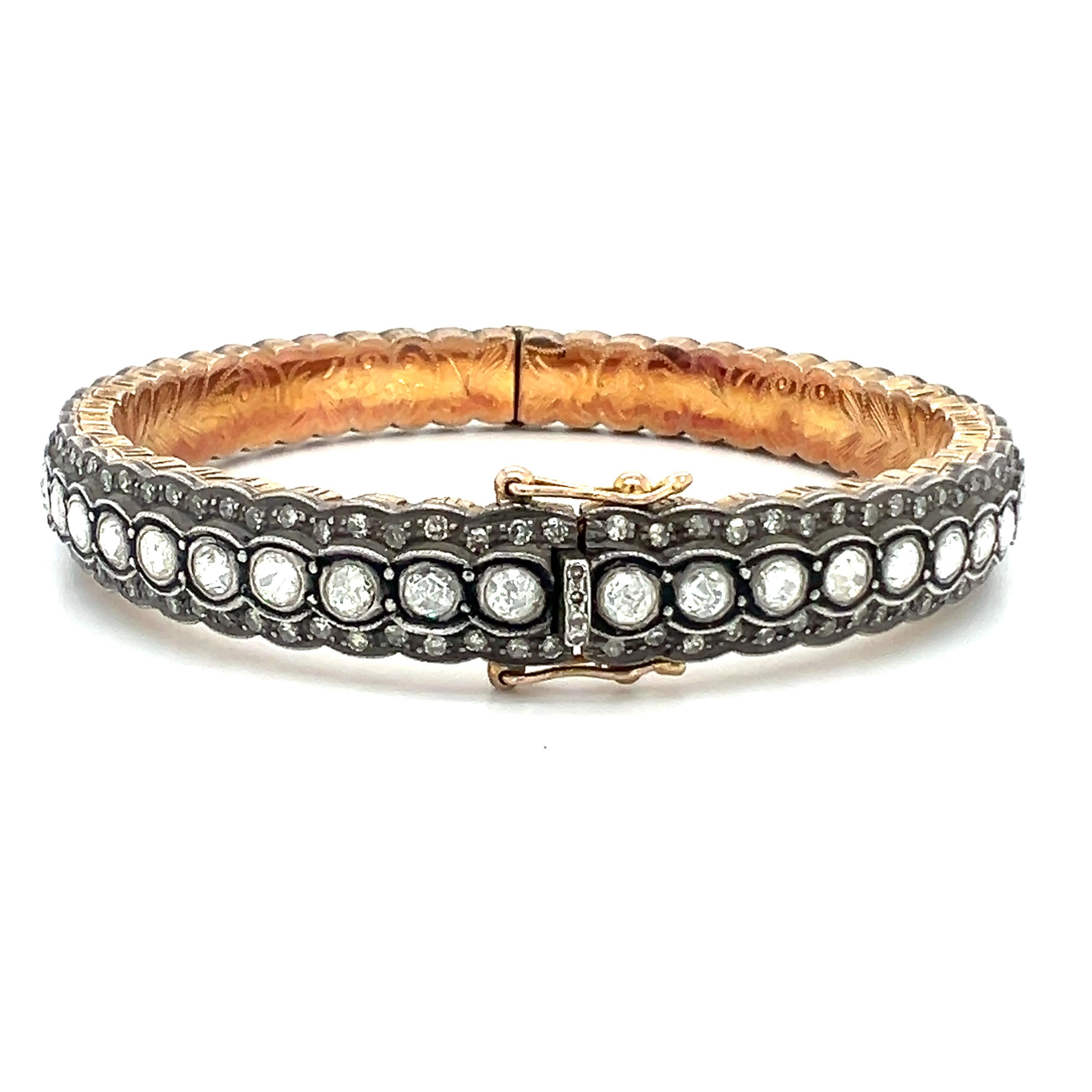 A beautiful solid sterling silver bangle feature with 7.20-carat natural diamonds. 