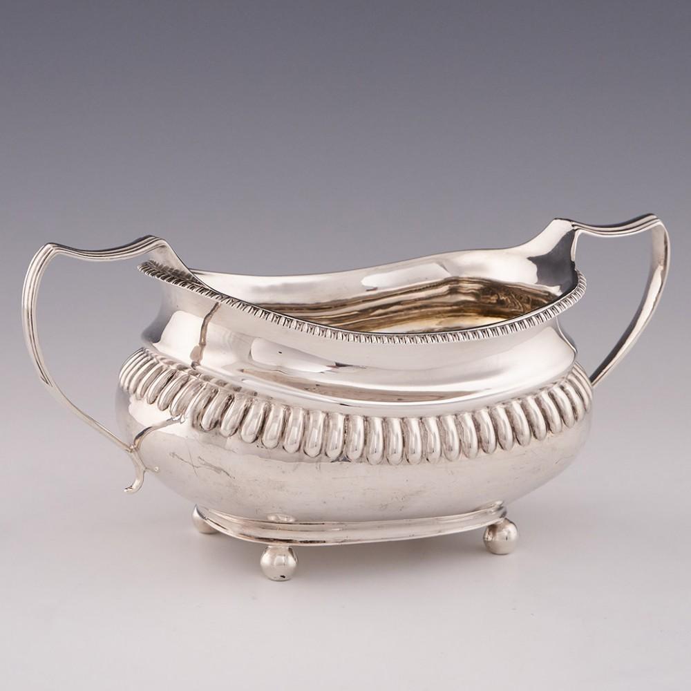 A Sterling Silver Sucrier and Cream Jug London, 1813

Additional information:
Date : Hallmarked in London 1813. Makers mark is rubbed and illegible. 
Period : George III
Origin : London, England 
Decoration : Gadrooned band around the waist of the