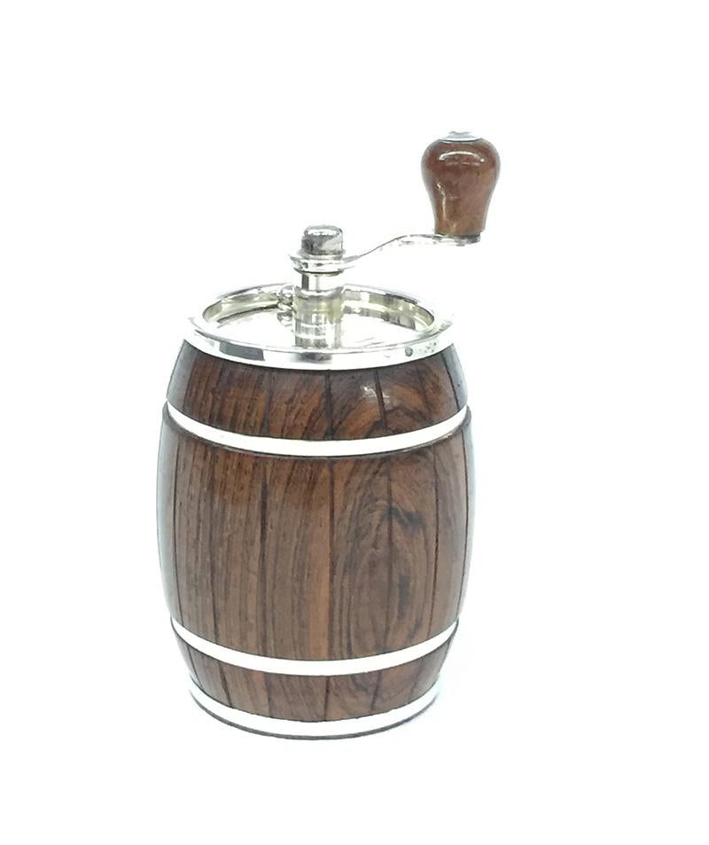 A sterling silver with rosewood wooden pepper mill. 

20th century
The silver lines around the barrel are nailed. ( see details in the pictures)

Marked with sterling 925 FS ( Fine Silver)
Also marked with the Dutch mark Z I 

The