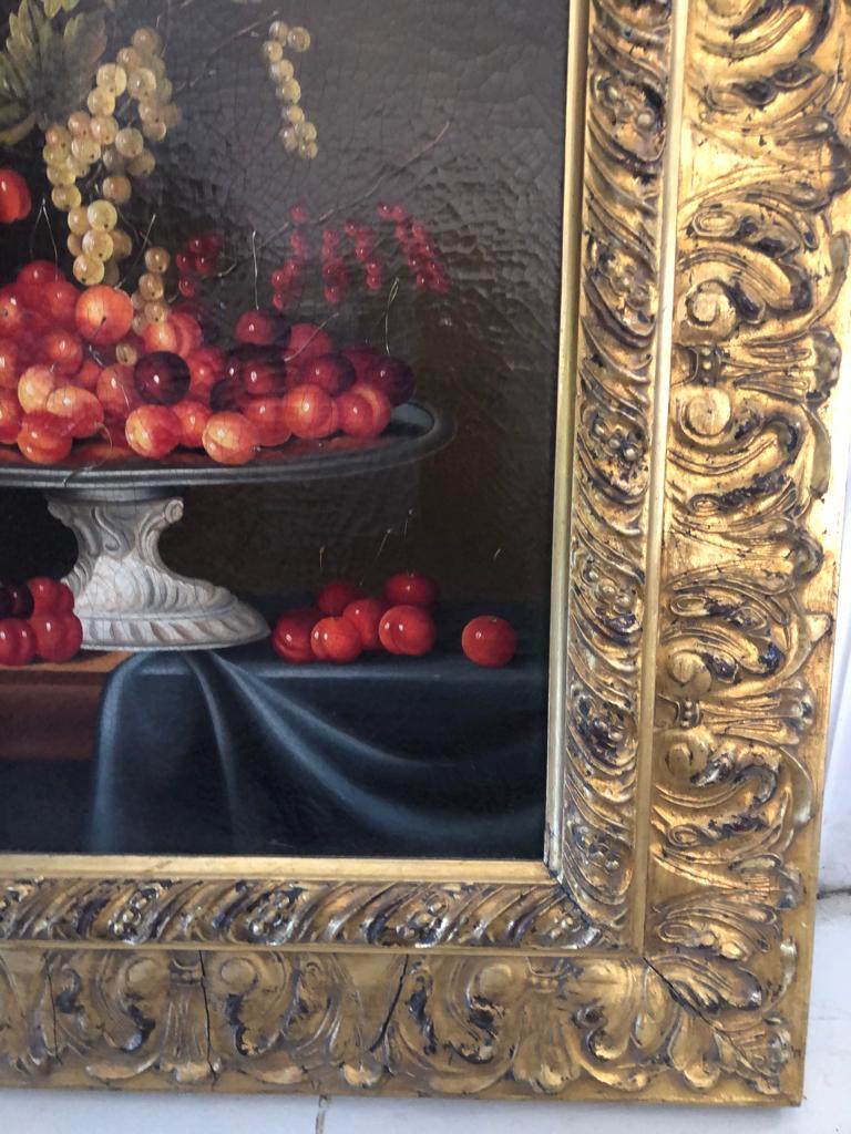 A still life painting of a bowl with Cherries and Berries. Finely painted by an unknown Italian artist. In a gilt and gesso frame.