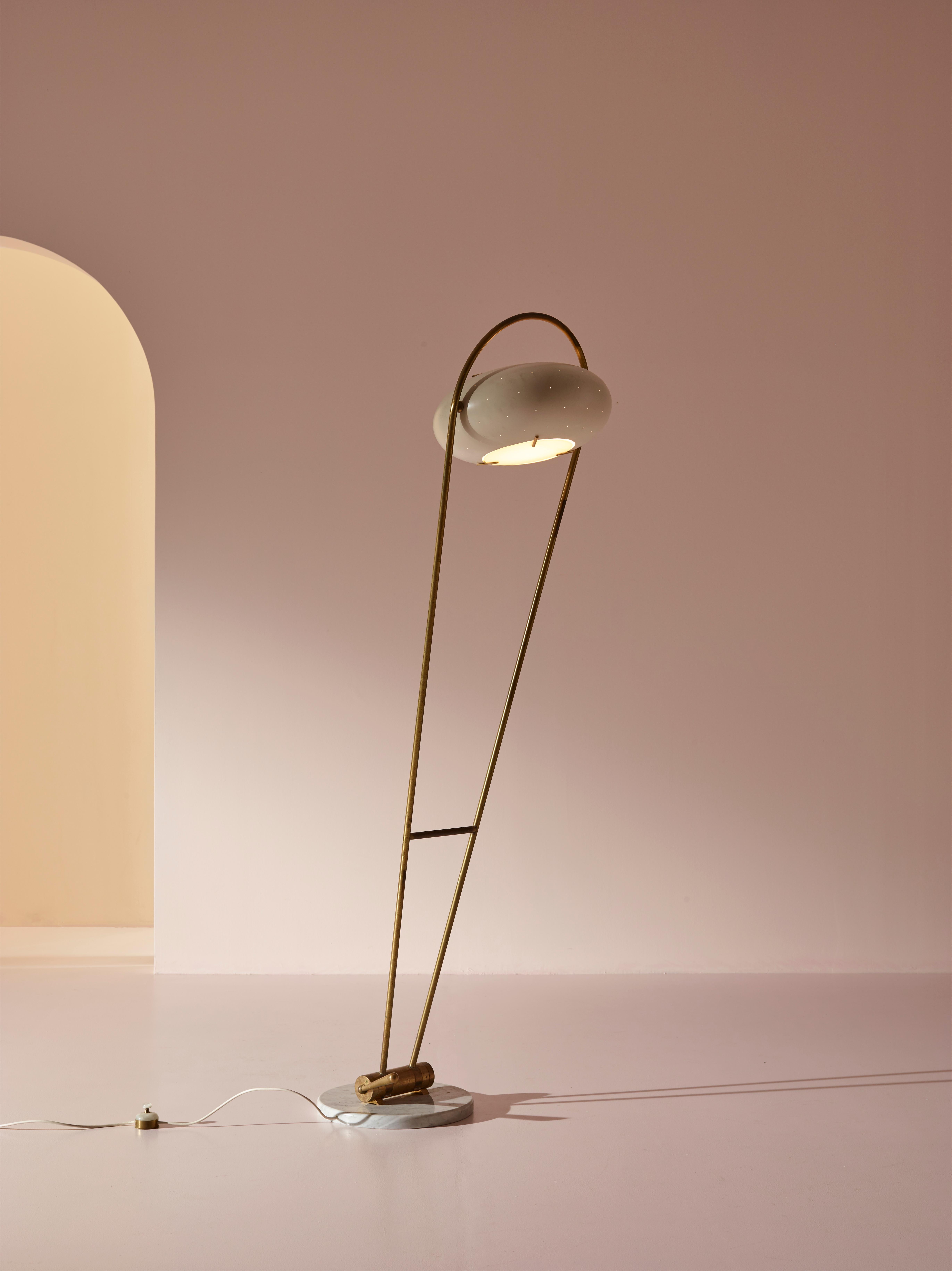 This charming floor lamp is a very rare lighting fixture that was manufactured by Stilux in Italy during the 1950s. Composed of high-quality materials, this lamp combines functionality with design, making it a sought-after piece for both collectors