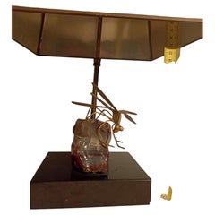 A stone and brass table lamp