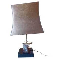 A stone and brass table lamp