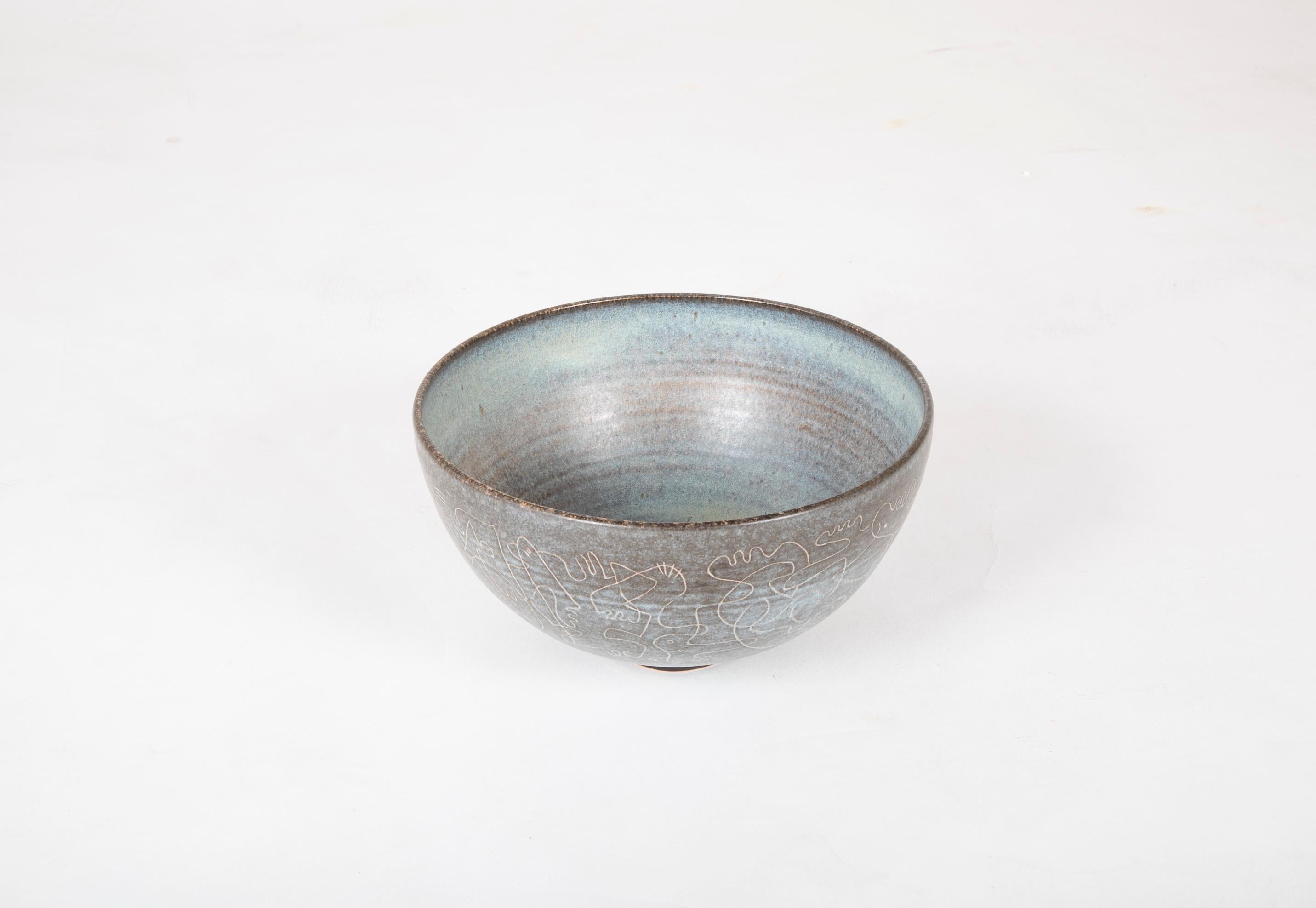 A blue and grey glazed stoneware bowl with scrafito decoration most likely from the late 1950s or early 1960s. Signed 