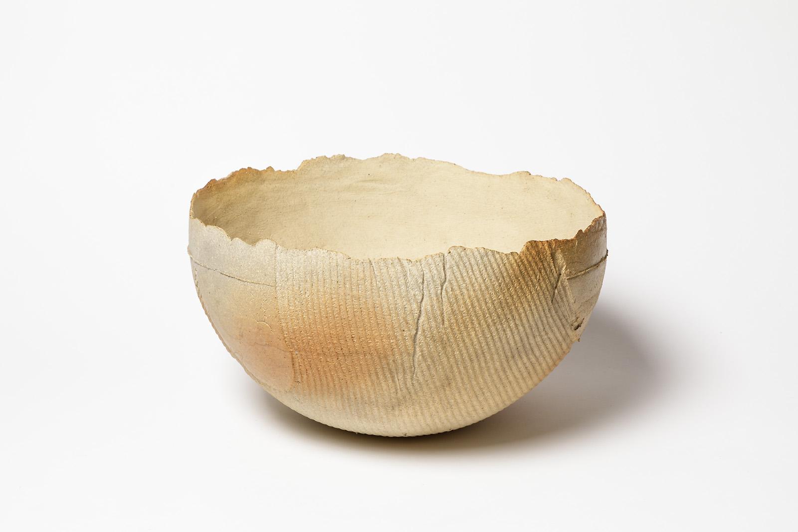 A stoneware sculptural bowl by Pierre Baey.
Perfect original conditions.
Circa 1970.

  