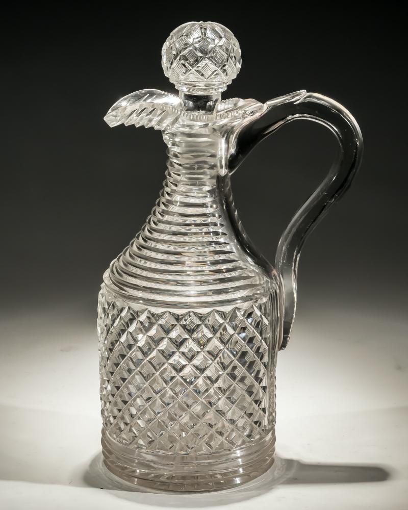 A strawberry diamond and step cut Regency claret jug.
Measures: height 26 cm (10 1/4