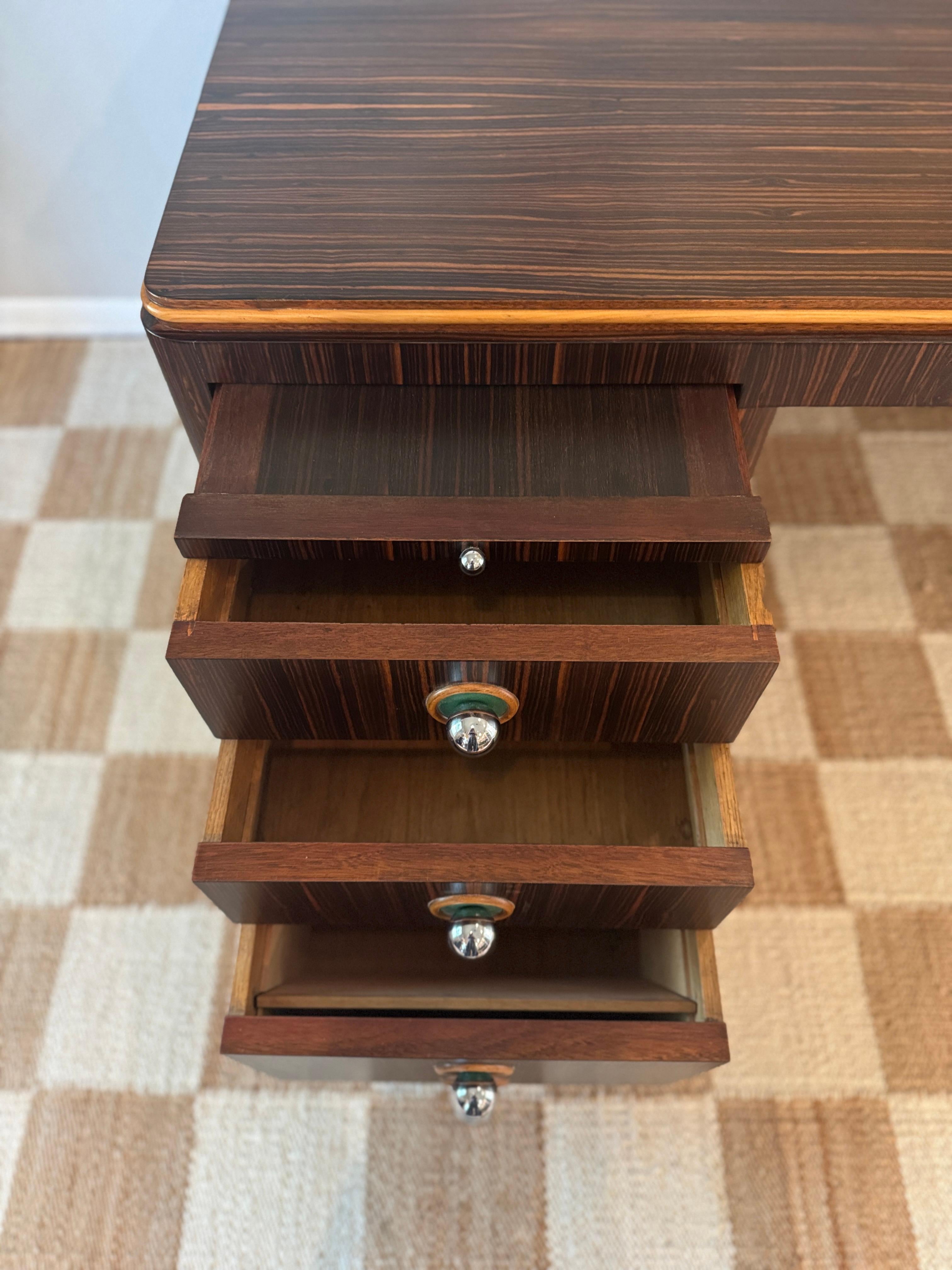 Wood A streamline rosewood desk from the Art Deco era, circa 1930s For Sale