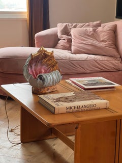 A striking hand-painted conch shell lamp, circa 1960