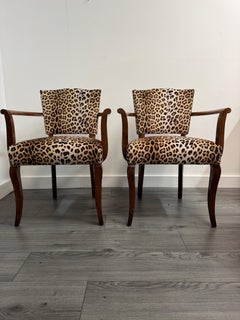 A striking pair of French 1940s occasional armchairs in leopard print velvet