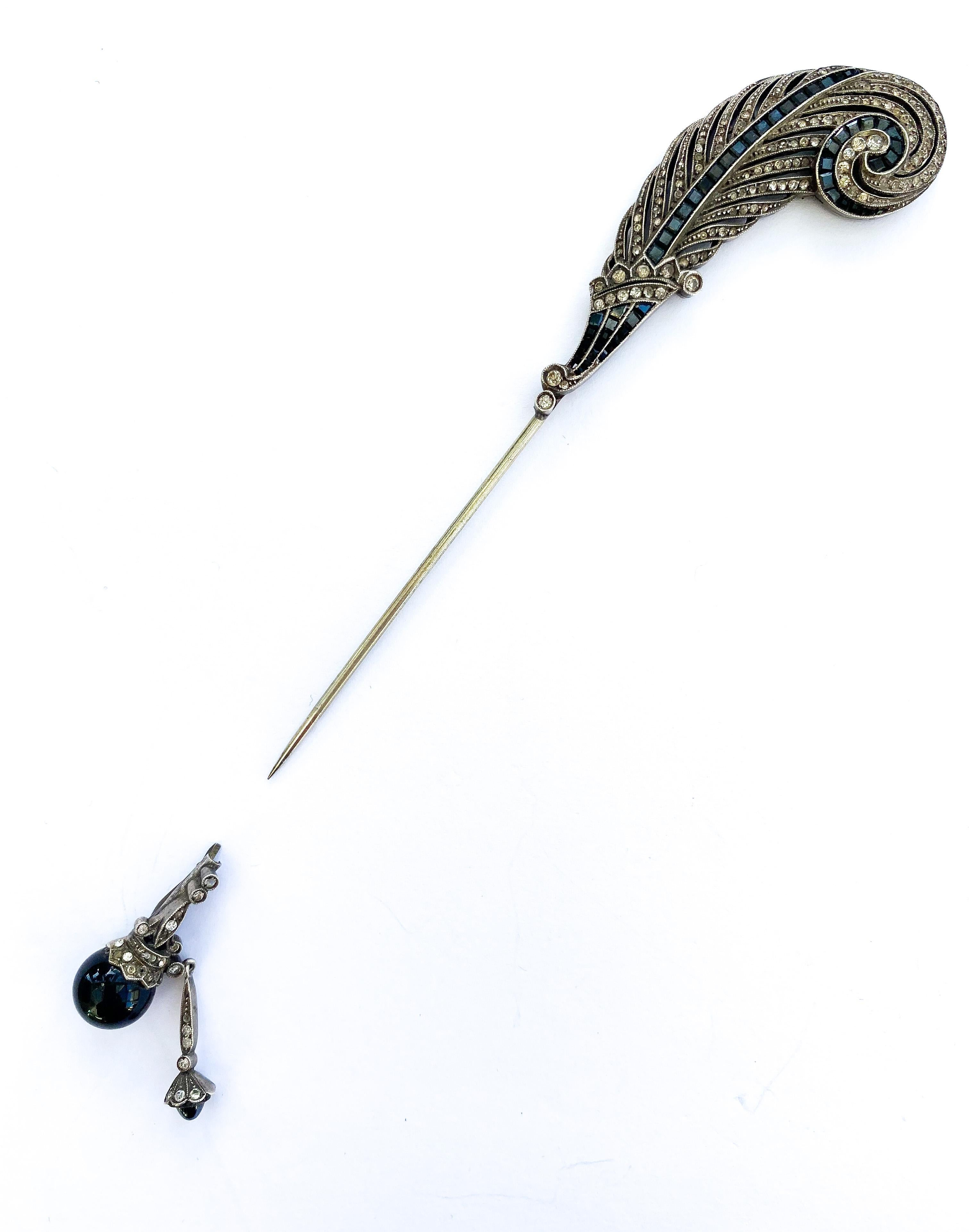 An exquisite and very stylish French  'jabot' pin, with a feather motif in clear and sapphire coloured pastes from the 1920s. Typical of Cartier designs of the same era, this beautiful and unusual piece evokes the highly decorative and stylised