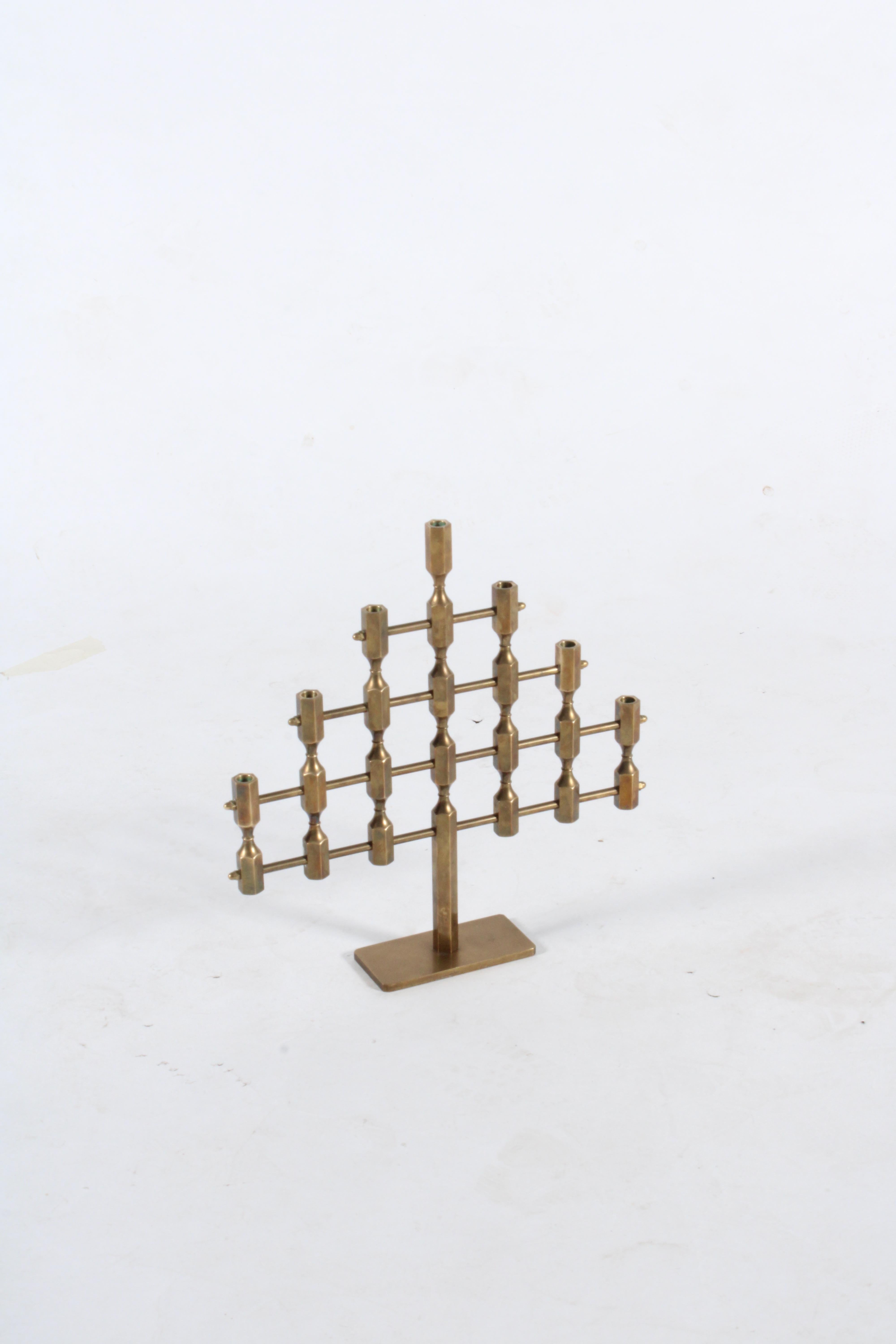 A superbly made beautiful solid brass candelabra by the internationally acclaimed Gusums Metallslojden of Sweden. A wonderful center piece for a dining table or mantle this candelabra will add style and ambiance to any room. Stamped, engraved and