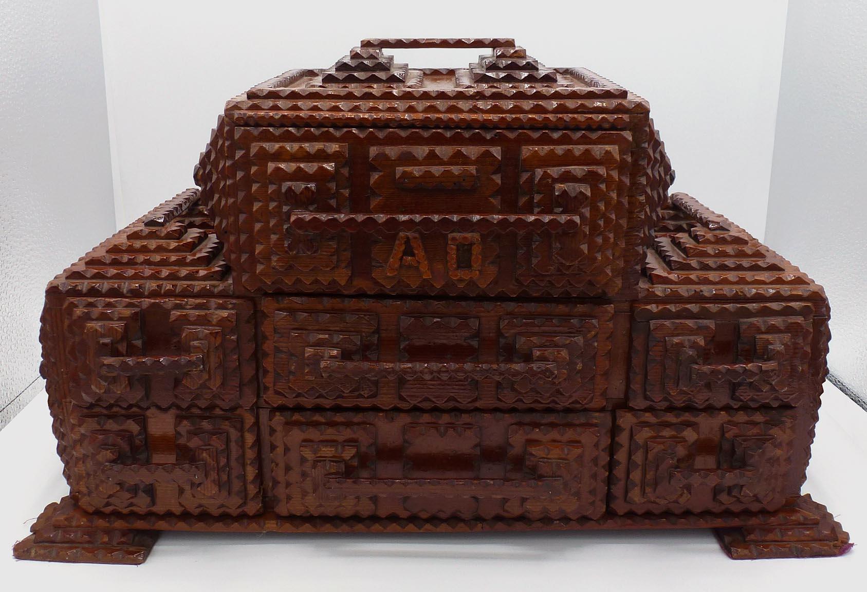 Hand-Carved Striking Tramp Art Box with Seven Drawers, Decorative Handles, Built Up Feet For Sale