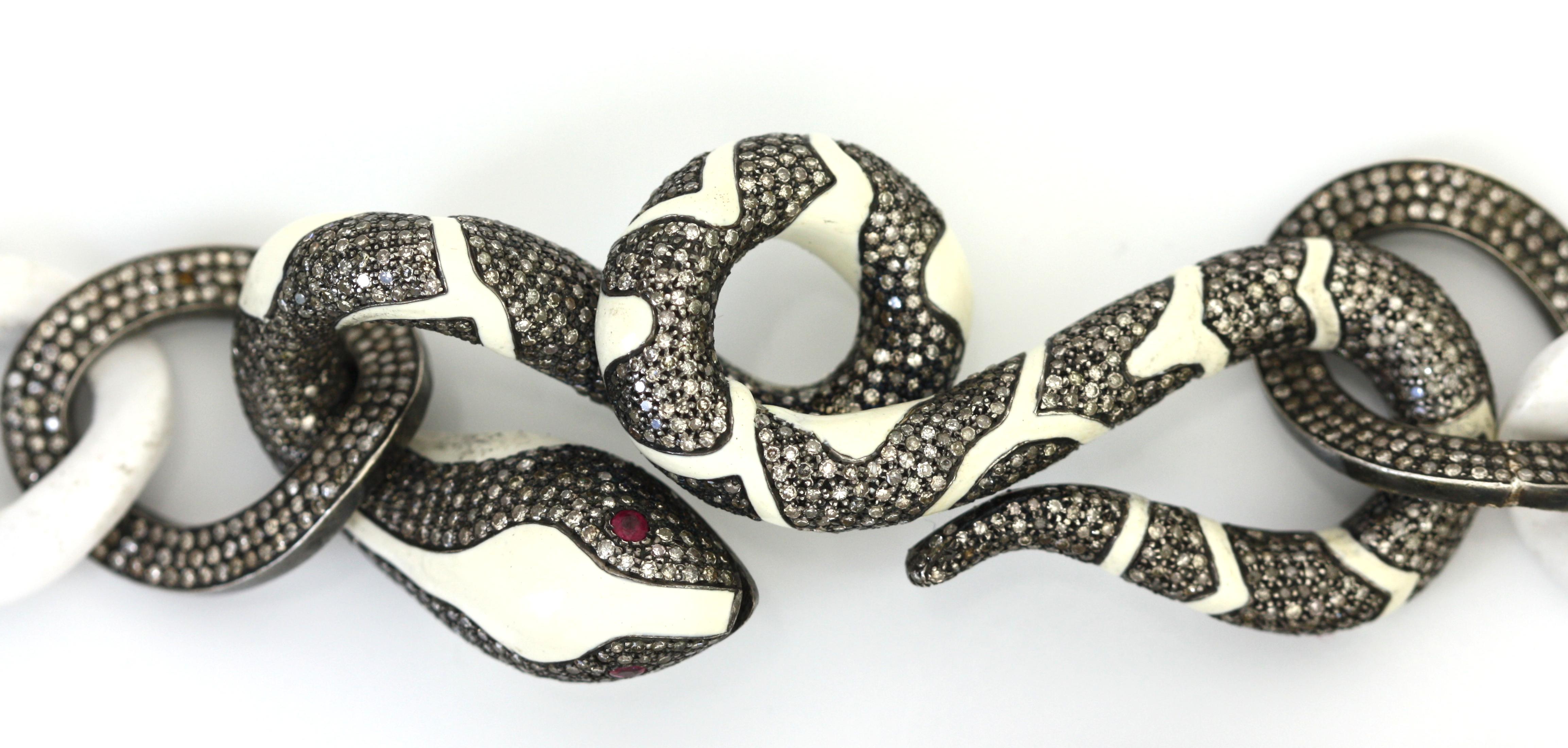 
A Striking White Ceramic and Diamond Serpent Necklace
This avant-garde necklace features bold white ceramic curb links, seamlessly interwoven with serpentine figures meticulously crafted in white enamel and set with pavé diamonds. The serpents,