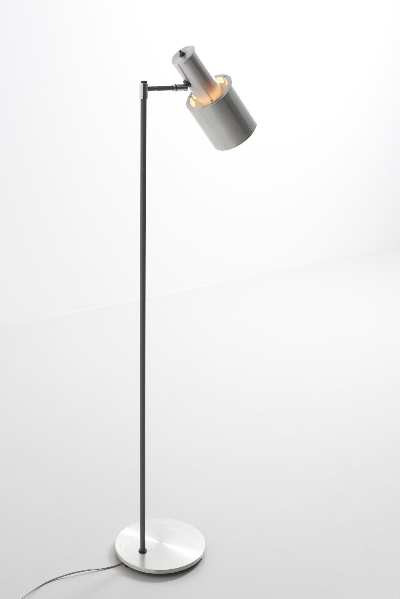 A floor lamp, model 'Studio'. Aluminium and grey lacquered steel. Design by Jo Hammerborg, produced by Fog & Mørup in Denmark. In working condition, with visible traces of wear.