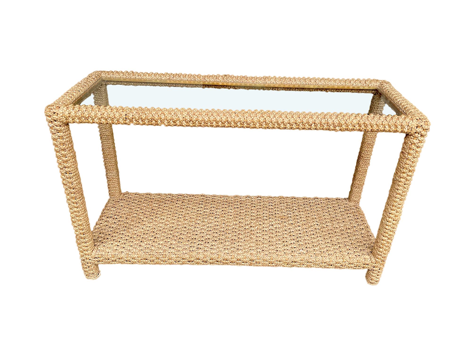 A stunning French 1950s hand woven rope console by Adrian Audoux and Frida Minet with single bevelled glass top shelf and orignal woven abaca rope and rattan frame all in perfect original condition.
