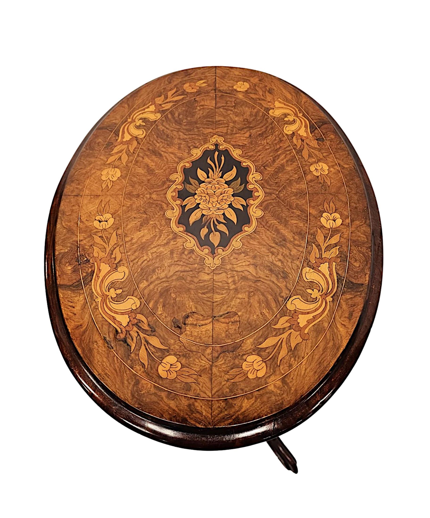 A very fine early 19th Century richly patinated marquetry and line inlaid burr walnut and mahogany flip top occasional or lamp table, finely hand carved, of exceptional quality and small proportions.  The well figured moulded, hinged top of oval