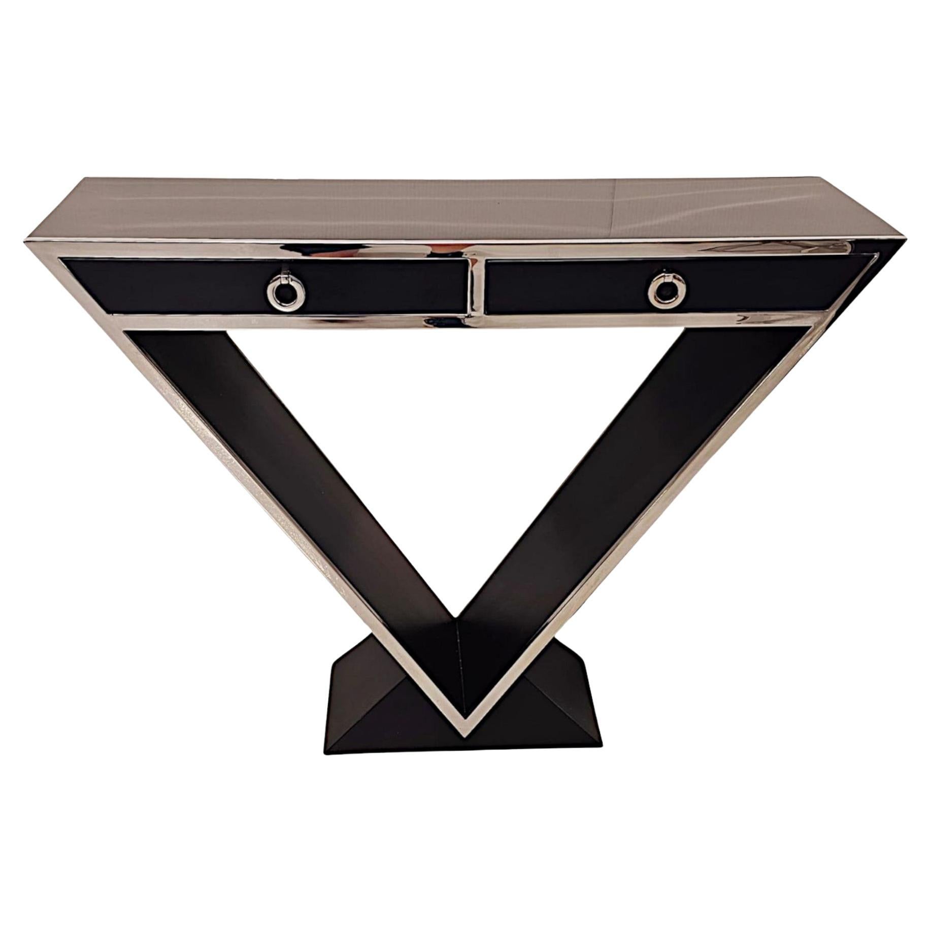  A Stunning Art Deco Style Black Laquered Timber and Chrome Console Table